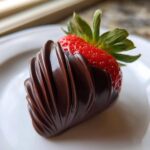 Close-up of a Chocolate Covered Strawberry Rose with piped dark chocolate shell.