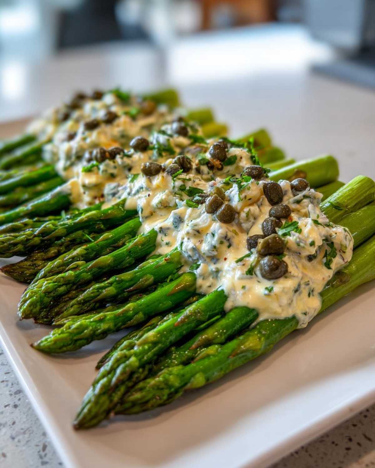 Bright green asparagus spears topped generously with creamy Sauce Gribiche and capers.